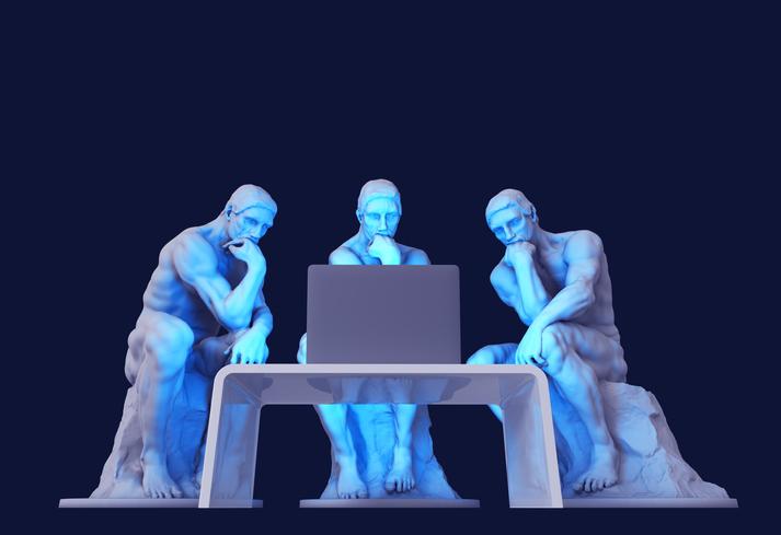 Three The Thinker statues around a laptop